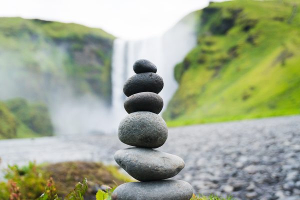 Stack of stones with a waterfall